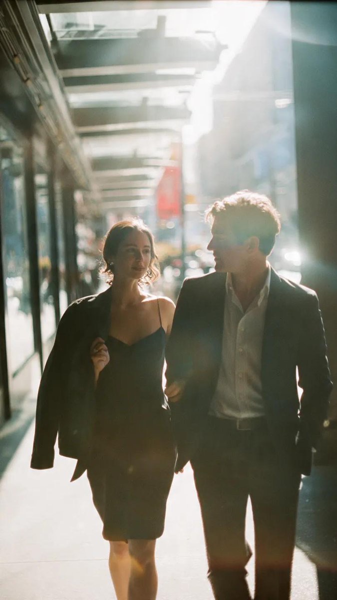 Prompt Seen couple cinematic street walk example with sharp midday light and film grain